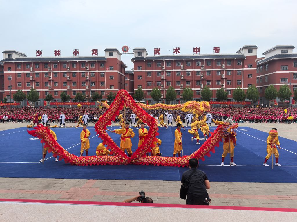 image shows disciples doing lion dance in Shaolin Kung Fu introduction